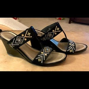 Pretty black wedge with gold & silver accents.